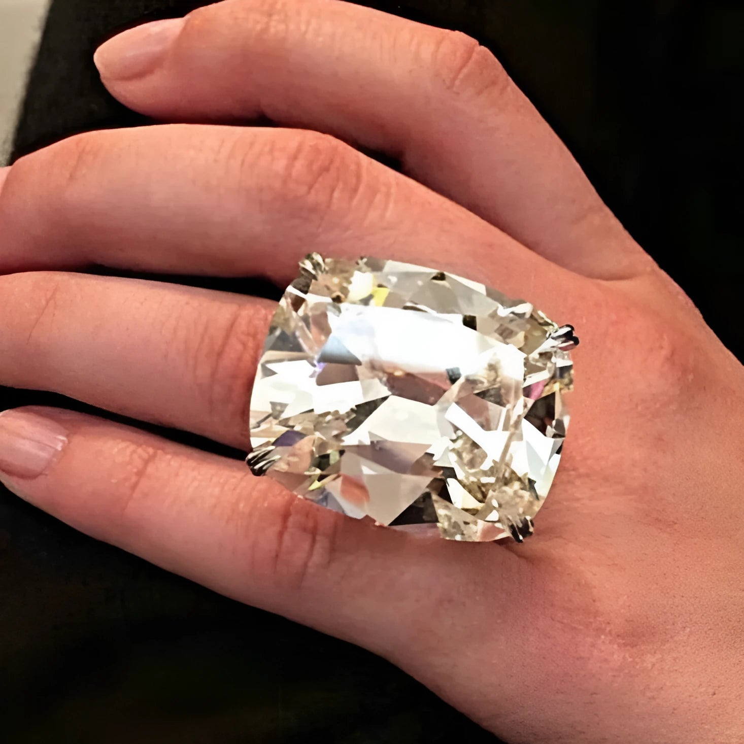 Simple inlaid square diamond ring in white gold colour on grey background