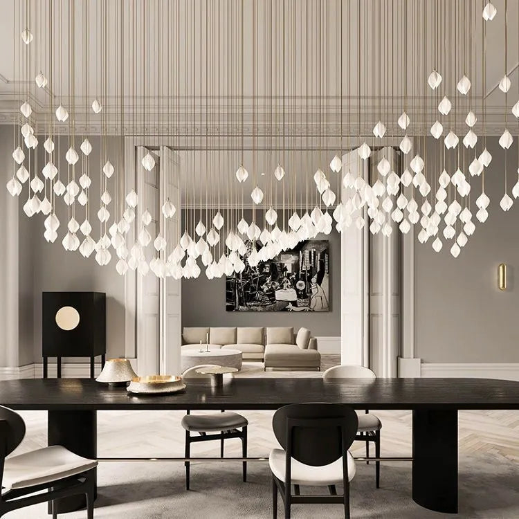 White ceramic magnolia flower single-head pendant ceiling light with dimmable bulb.