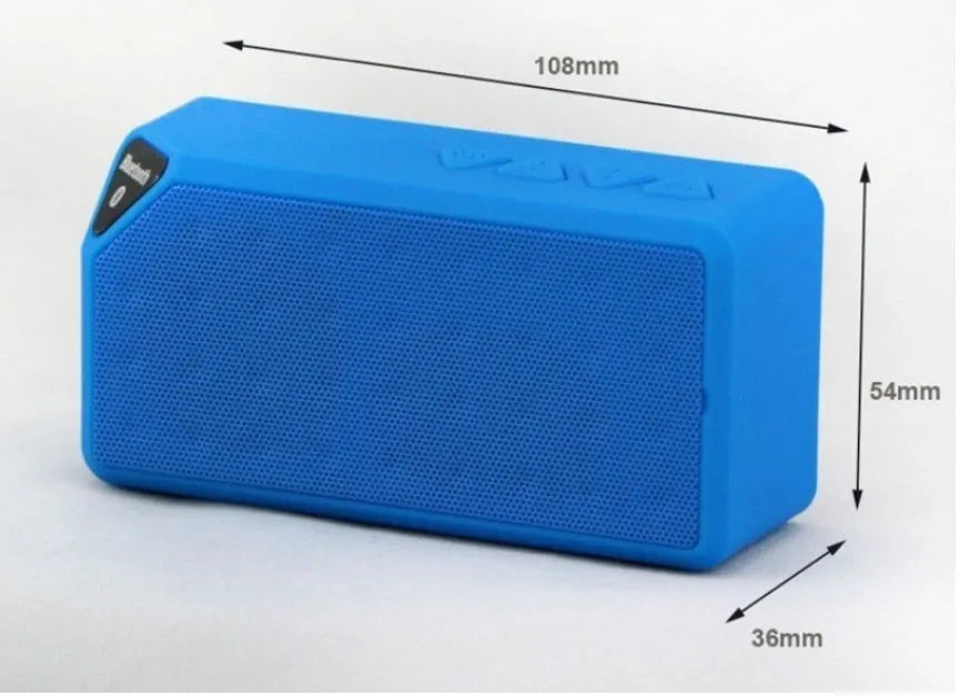 Cannon X3 small cube-shaped portable Bluetooth speaker in multiple colours on a table