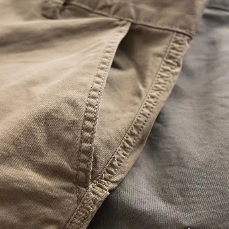 Men's solid colour cotton multi-pocket labour protection trousers in a cropped length.