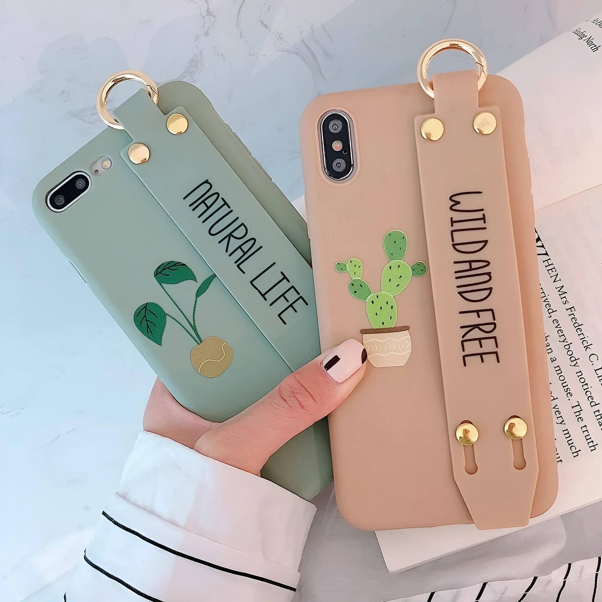 Green wristband holder phone case with graffiti design for iPhone, showing the integrated carrying loop.