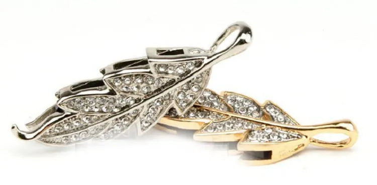 Silver metal USB flash drive with a crystal leaf decoration showing front view and size.