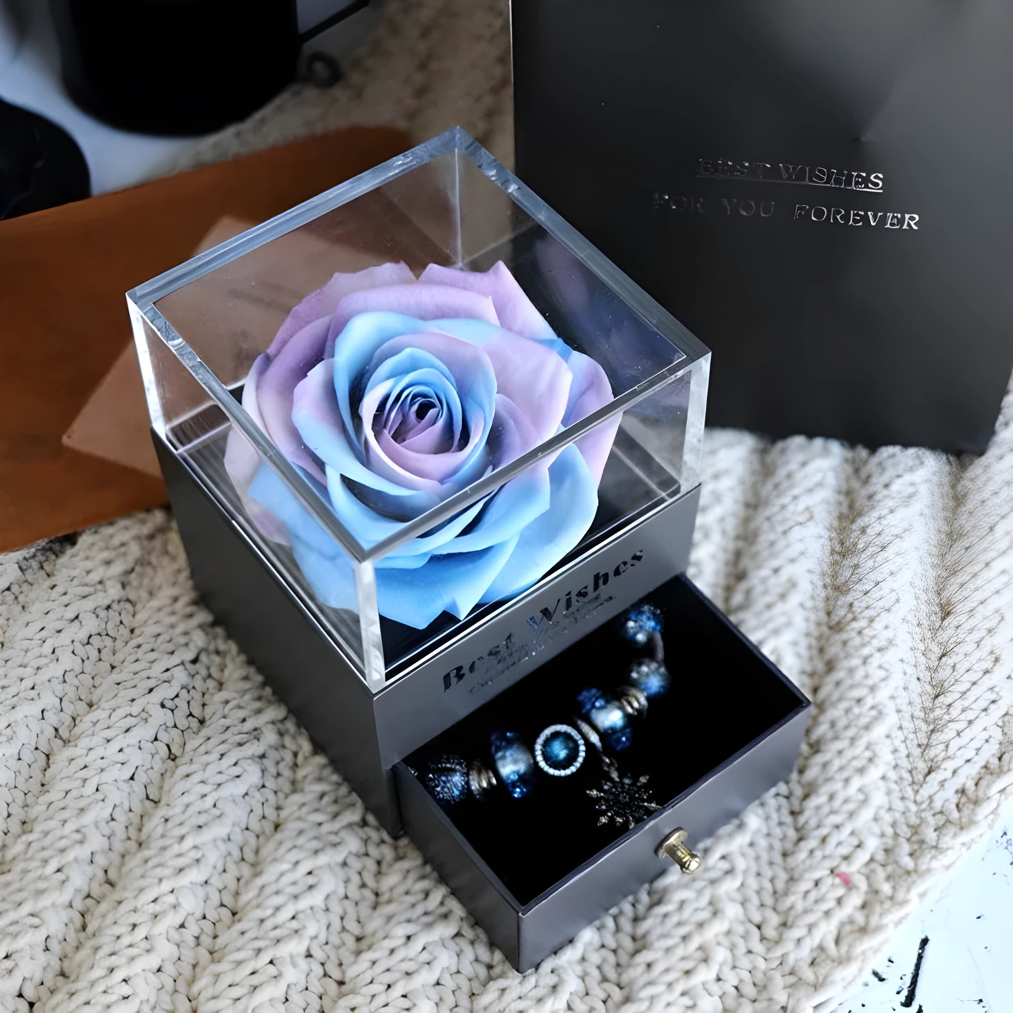 Eternal Flower gift box with preserved roses and carnations inside, measuring 8.5 cm square by 10.5 cm high