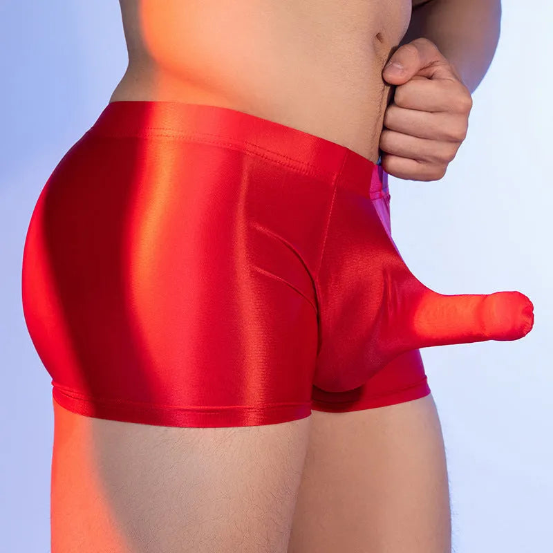 Men's red boxer shorts with an elephant nose pattern, showing mid-waist and seamless design.
