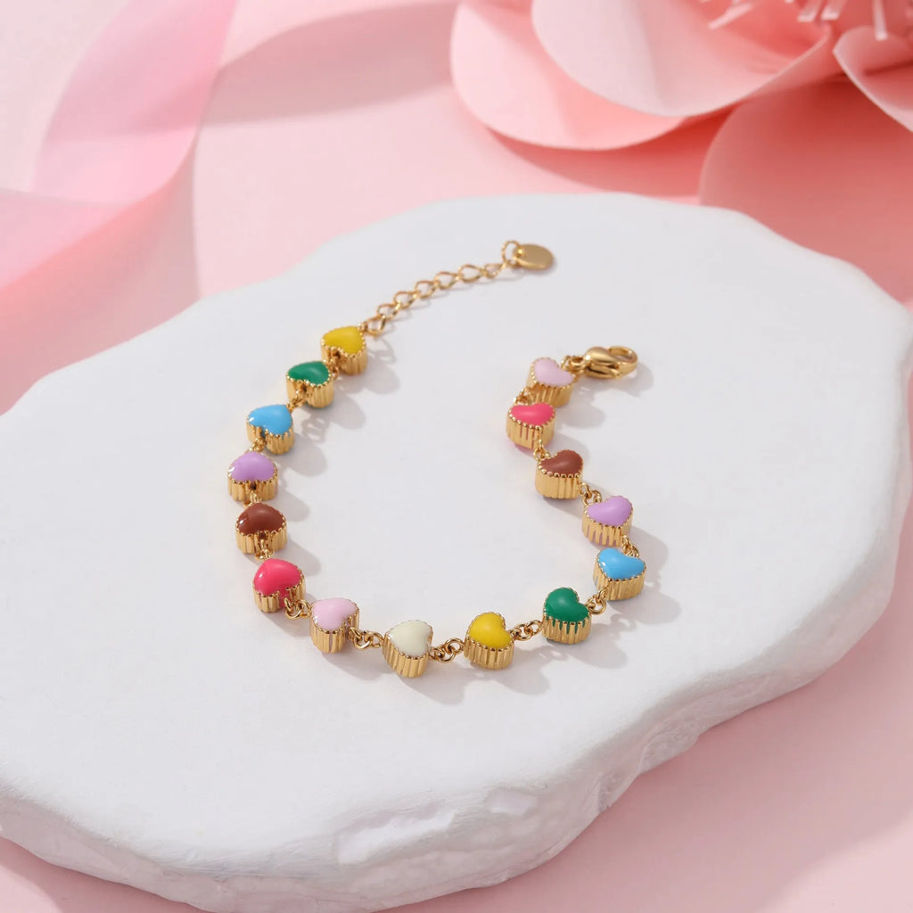 Gold or steel coloured heart-shaped titanium steel bracelet with electroplated finish for women's fashion wear