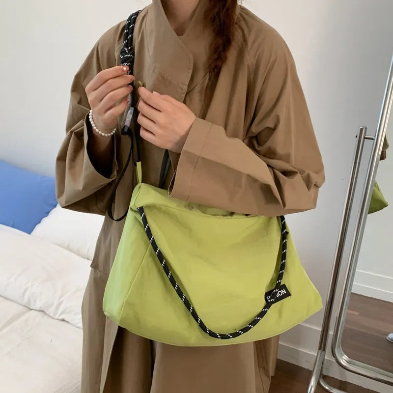 Large capacity soft cloth crossbody bag in beige with sewn detail, available in six colours