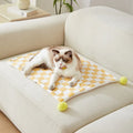 Plaid pattern pet blanket with fur ball decorations in green, pink or yellow colours