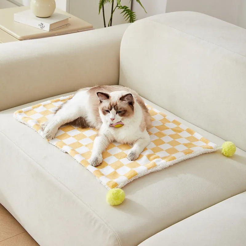Plaid pattern pet blanket with fur ball decorations in green, pink or yellow colours