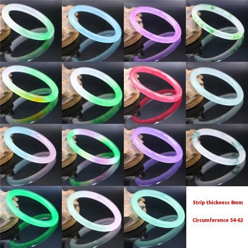 Jade bracelet with floating flower design and auspicious cloud patterns in ice-like emerald finish