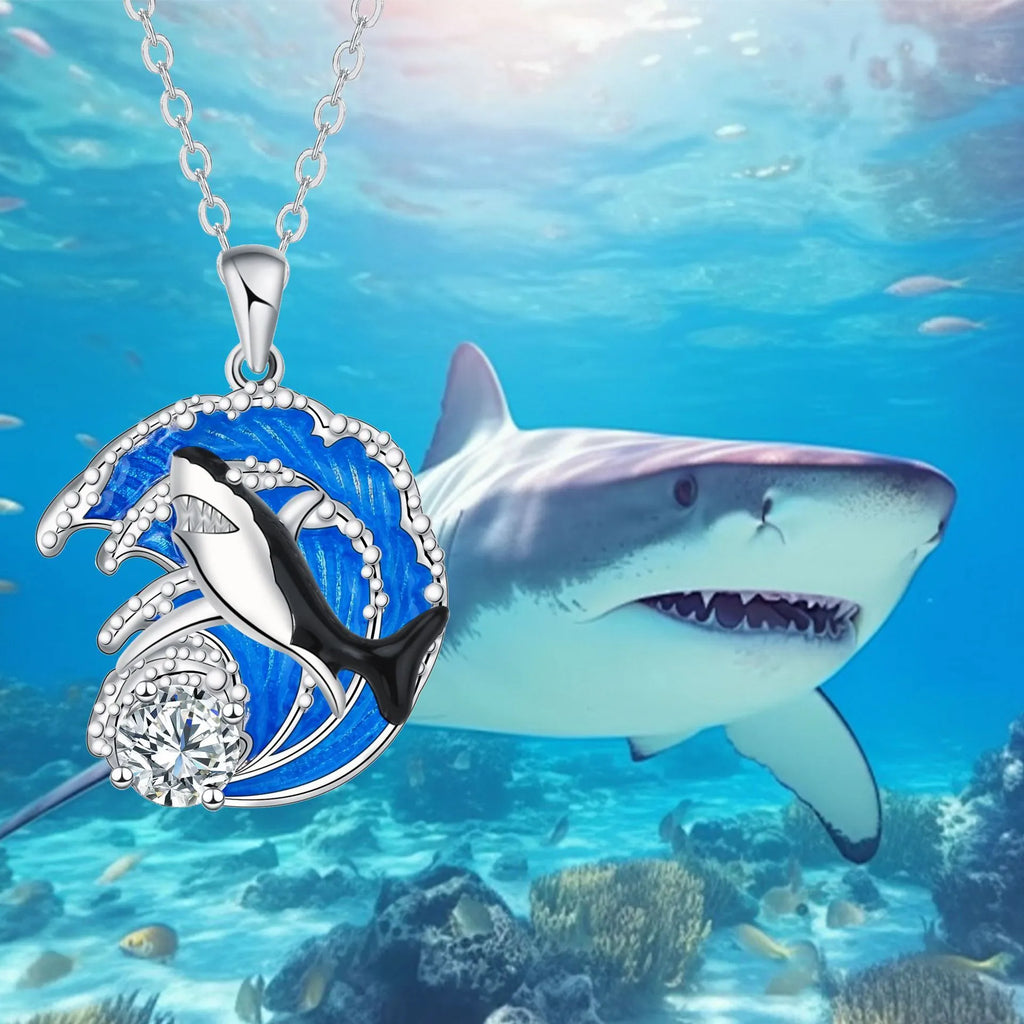 Women's shark pendant necklace with copper electroplated finish on a cross chain