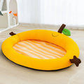 Green pet bed with fruit-patterned backrest, shown in large size for dogs.