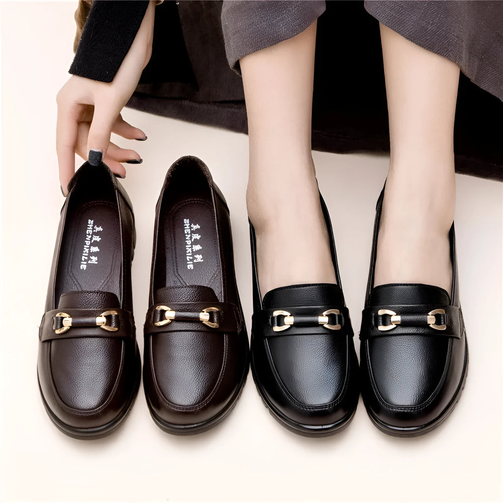 Black soft leather women's pumps with round toe and low flat heel