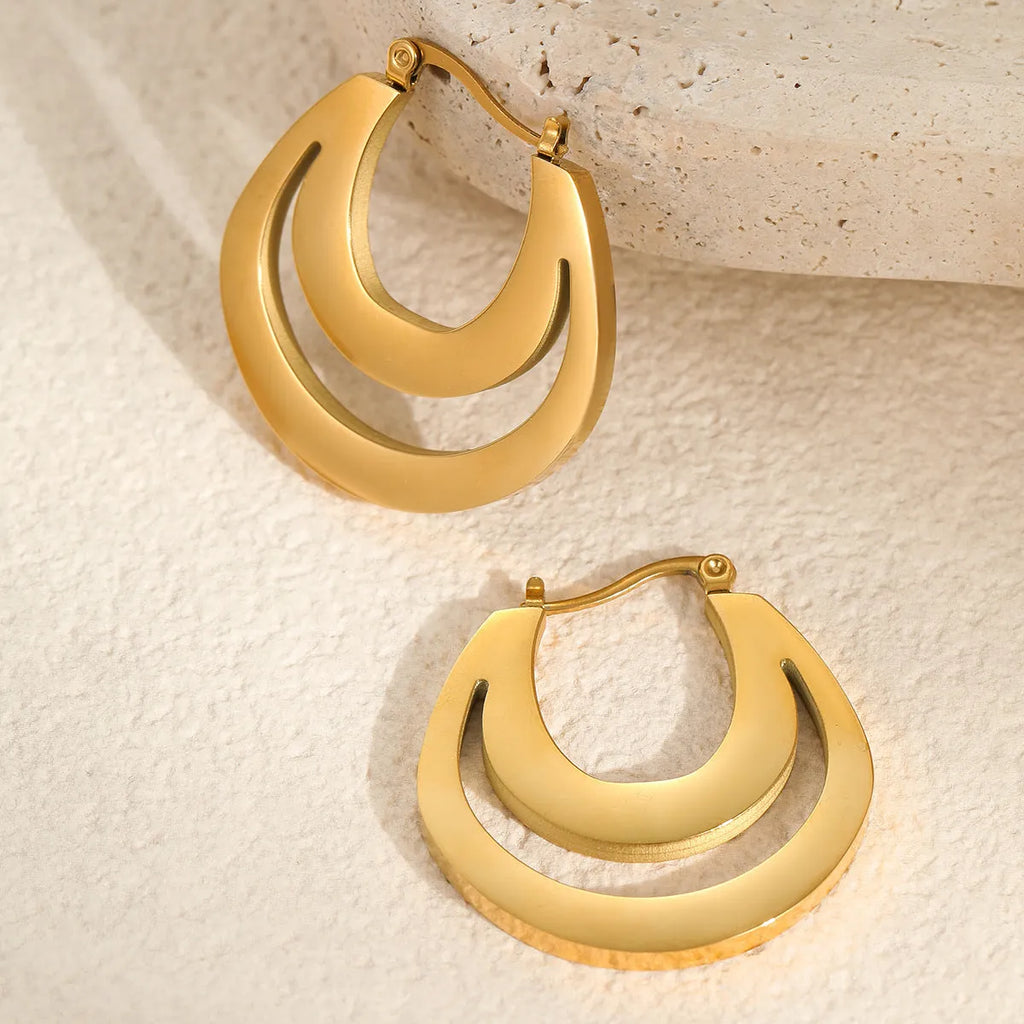 Geometric French hook earrings with round design in gold and steel metallic finishes