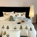 Pure cotton four-piece bedding set with embroidered Christmas tree pattern showing duvet cover, bed sheet and pillowcases