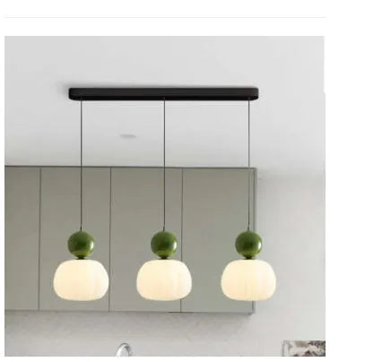Nordic pumpkin-shaped alloy chandelier for ceiling mounting in a bedroom or dining room.
