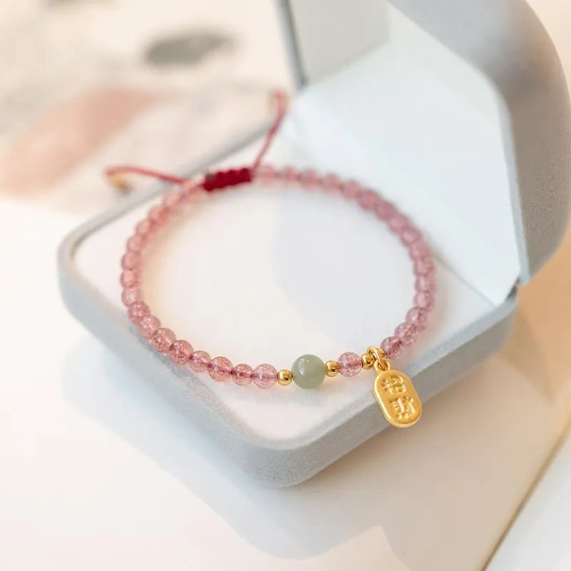 Hand-woven red rope bracelet with crystal beads in strawberry quartz or garnet variants