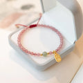 Hand-woven red rope bracelet with crystal beads in strawberry quartz or garnet variants