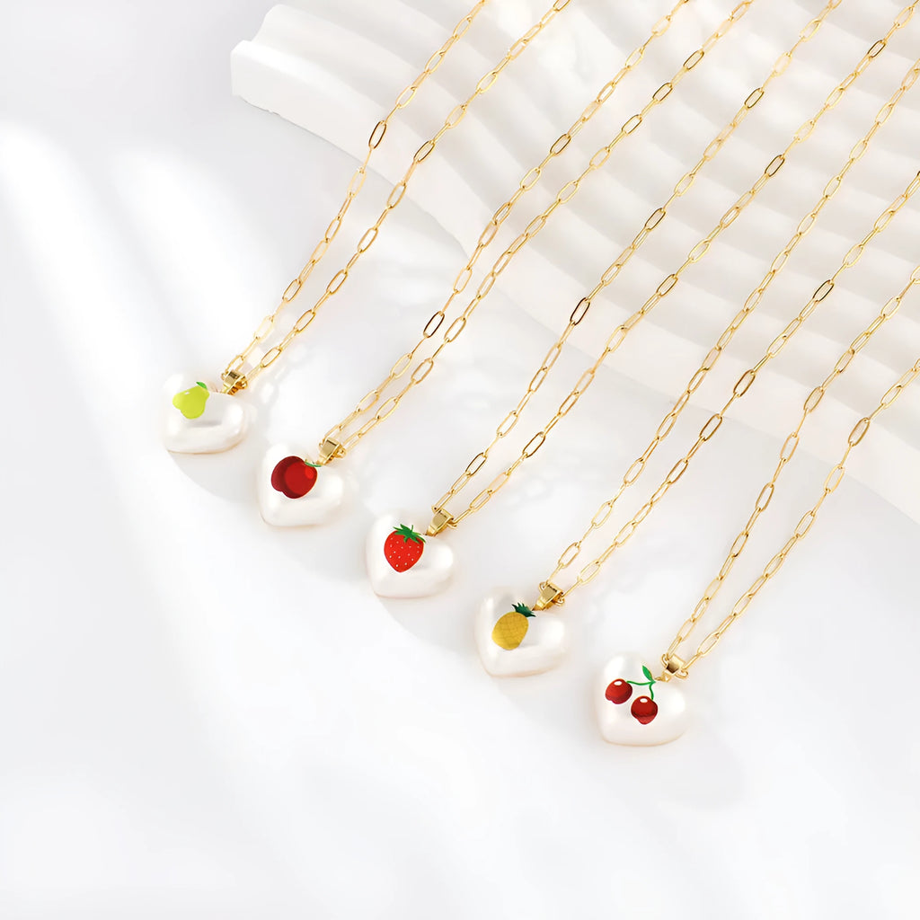 Geometric heart fruit pendant necklace with adjustable chain showing strawberry, pineapple, apple designs