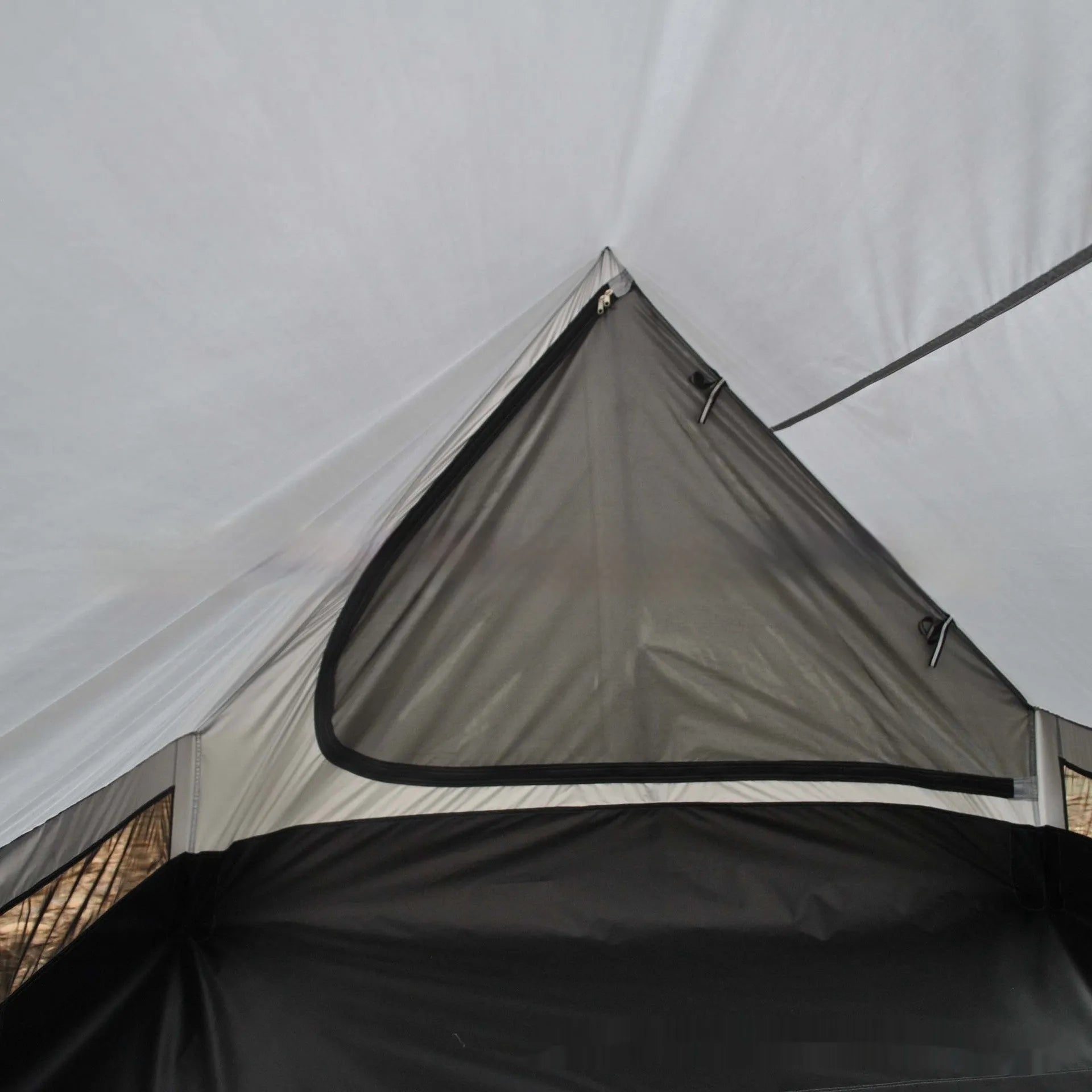 Brown A-line pole-free portable tent with hiking cane support showing interior space for 2-3 people