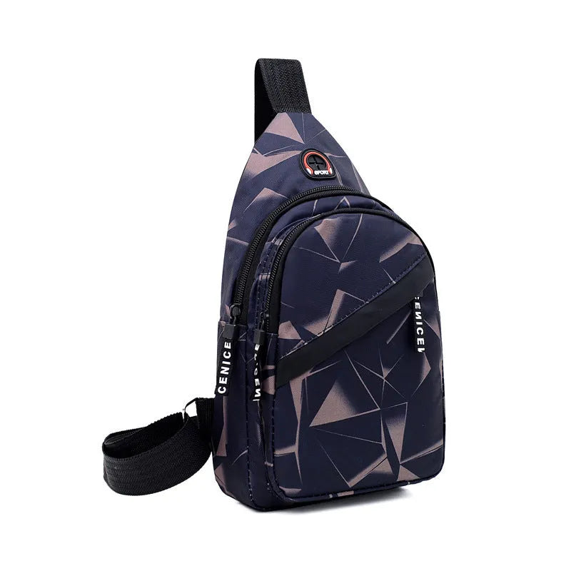Men's blue Oxford cloth crossbody sling bag with earphone hole design showing zipper opening and letter print detail