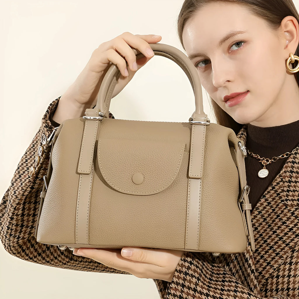 Genuine leather ladies handbag with contrast stitching and metal lock detail