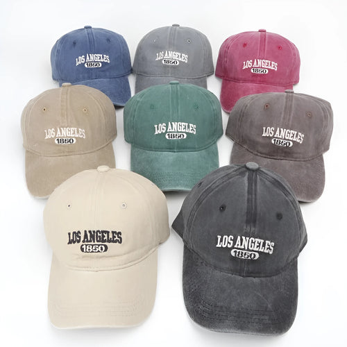 Adult personalised embroidered peaked cap in beige with adjustable strap and distressed lettering.