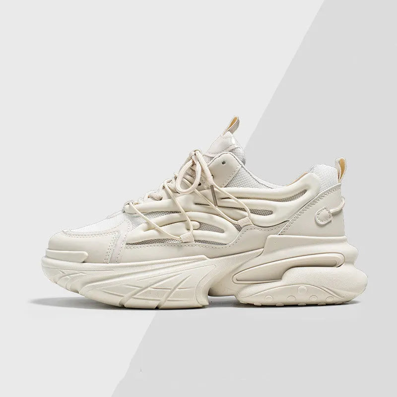 Men's beige and black low-top sneakers with mesh upper and rubber sole, showing lace-up front.