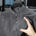 Men's loose fit short sleeve linen shirt in cardigan style with a stand collar.