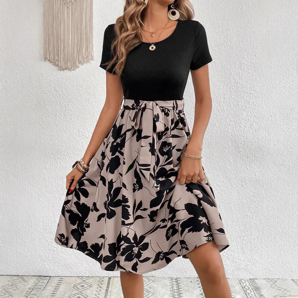 Women's khaki casual dress with floral print, A-line skirt, lace-up detail, and shoulder straps.