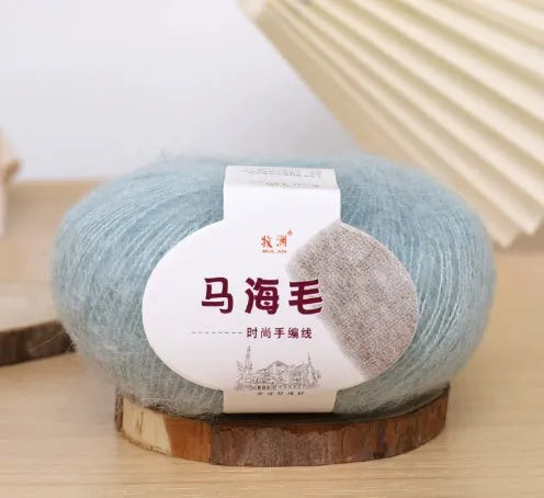 Mohair wool ball for DIY scarf knitting in assorted colours on white background