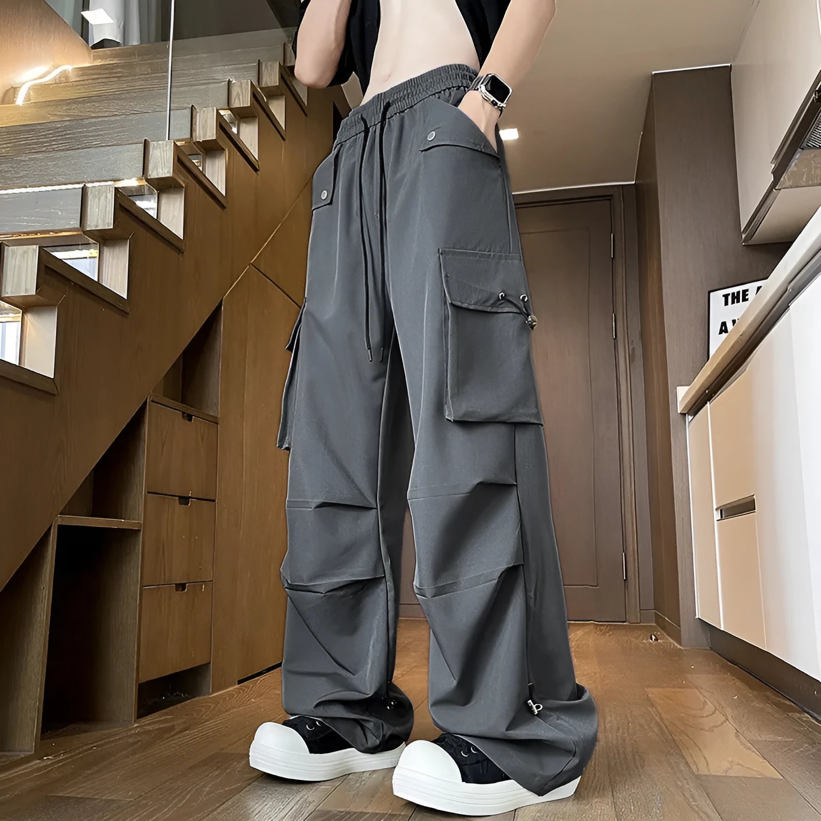Plus size waterproof trousers in black straight-leg style with drawstring waist