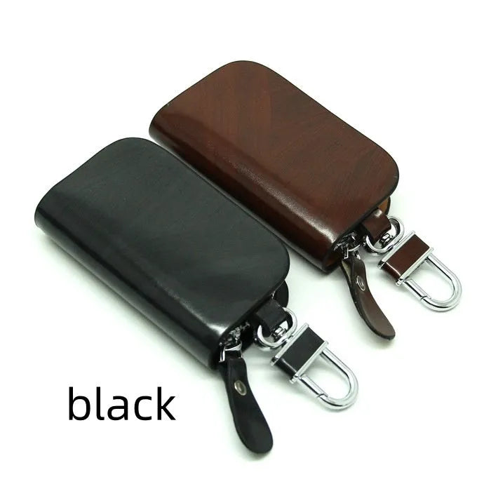 Genuine leather car key case with zipper in black and brown frosted finish.