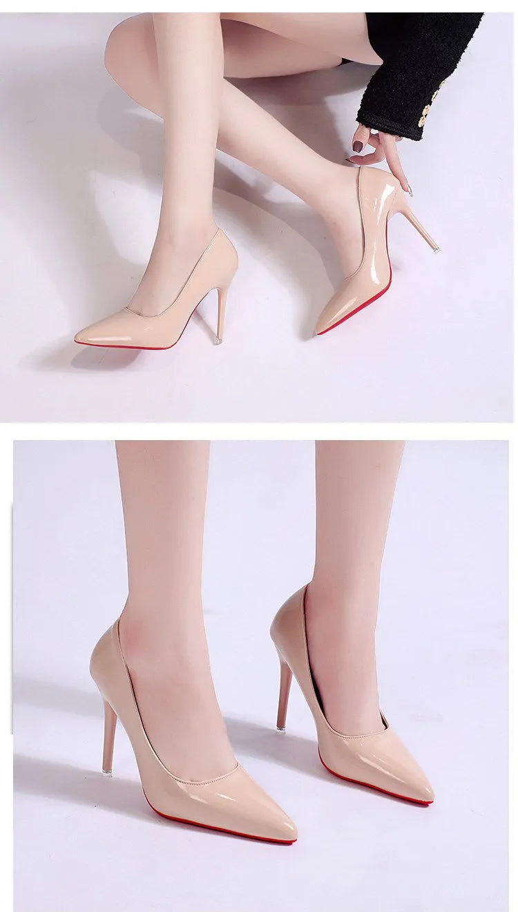 Women's black pointed toe stiletto pumps with a low-cut vamp and thin high heel on a white background.