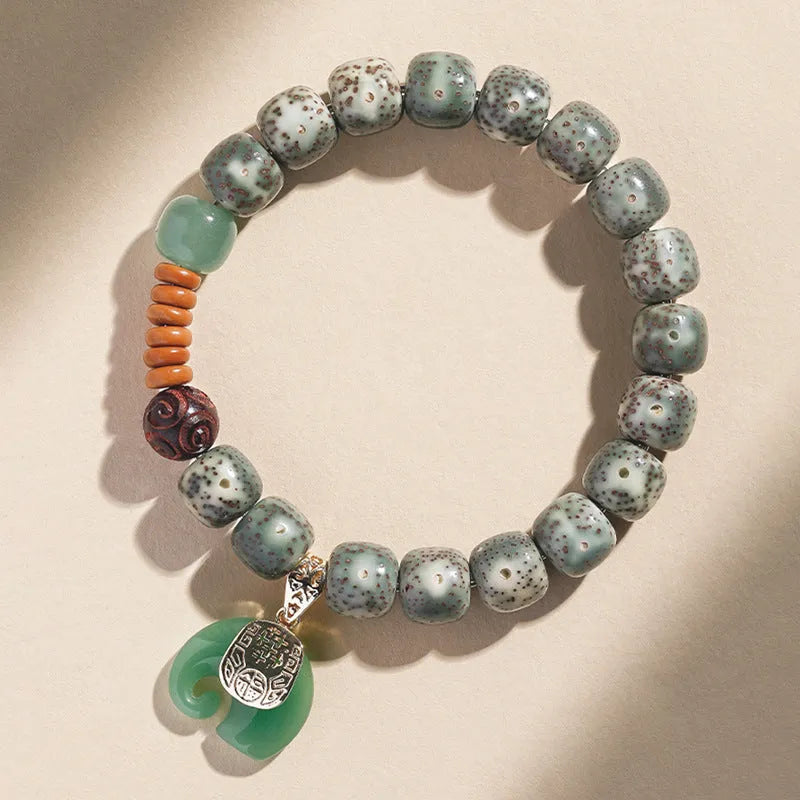 Jade green star moon bodhi bracelet with 10mm geometric beads on white background
