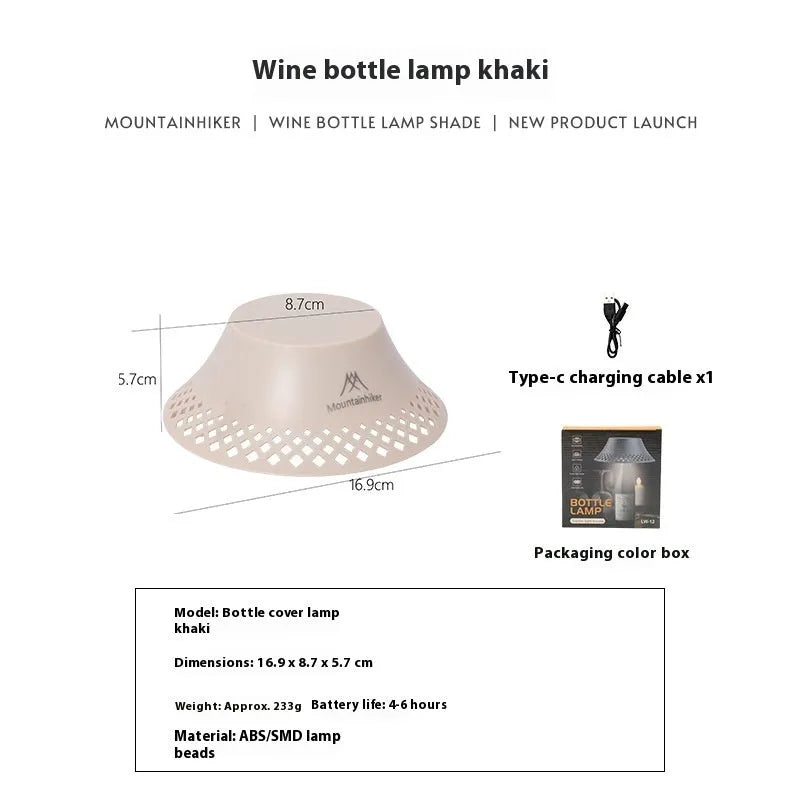 Beige wine bottle shaped camping lantern with USB-C port shown on a table.