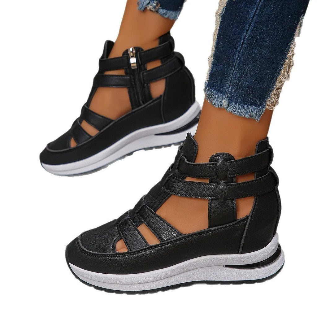Women's black close-toed hollow-out platform sandals with Velcro strap on a white background