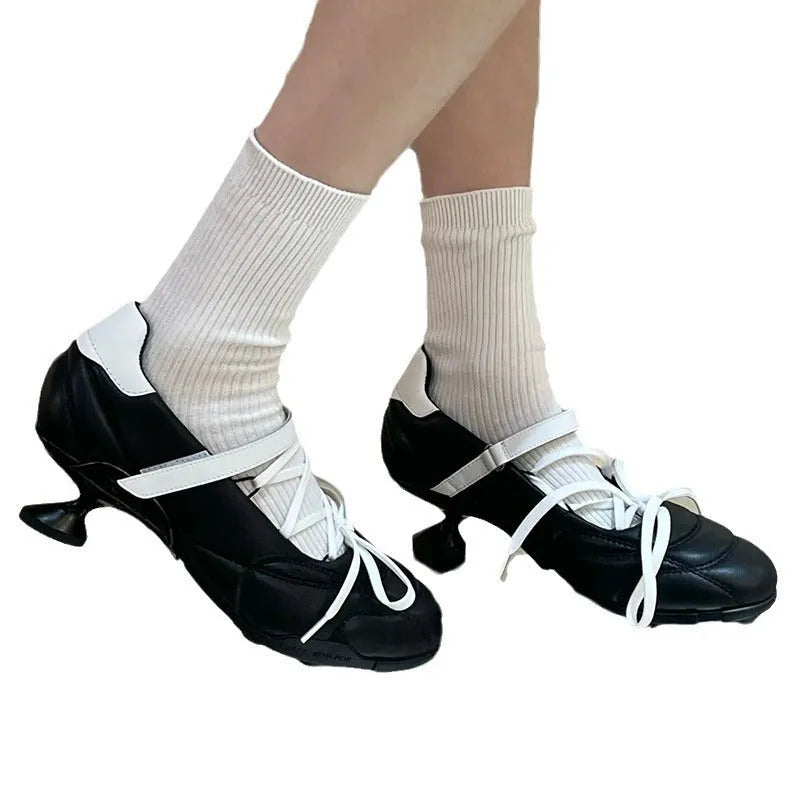 Women's silver lace-up bow sports shoes with a low-top and round toe on a white background.