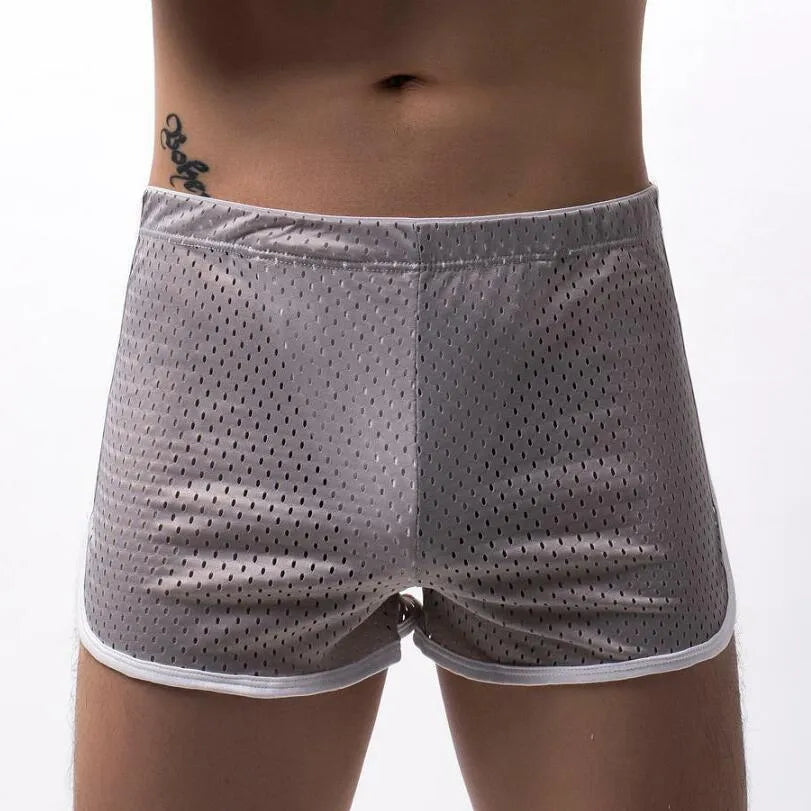 Men's three-point boxers in black, gray, and blue showing breathable knitted cotton nylon fabric and mid-waist fit.