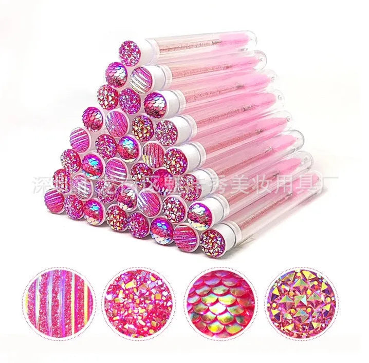 Set of coloured disposable eyelash spoolie brushes inside clear plastic storage tubes.