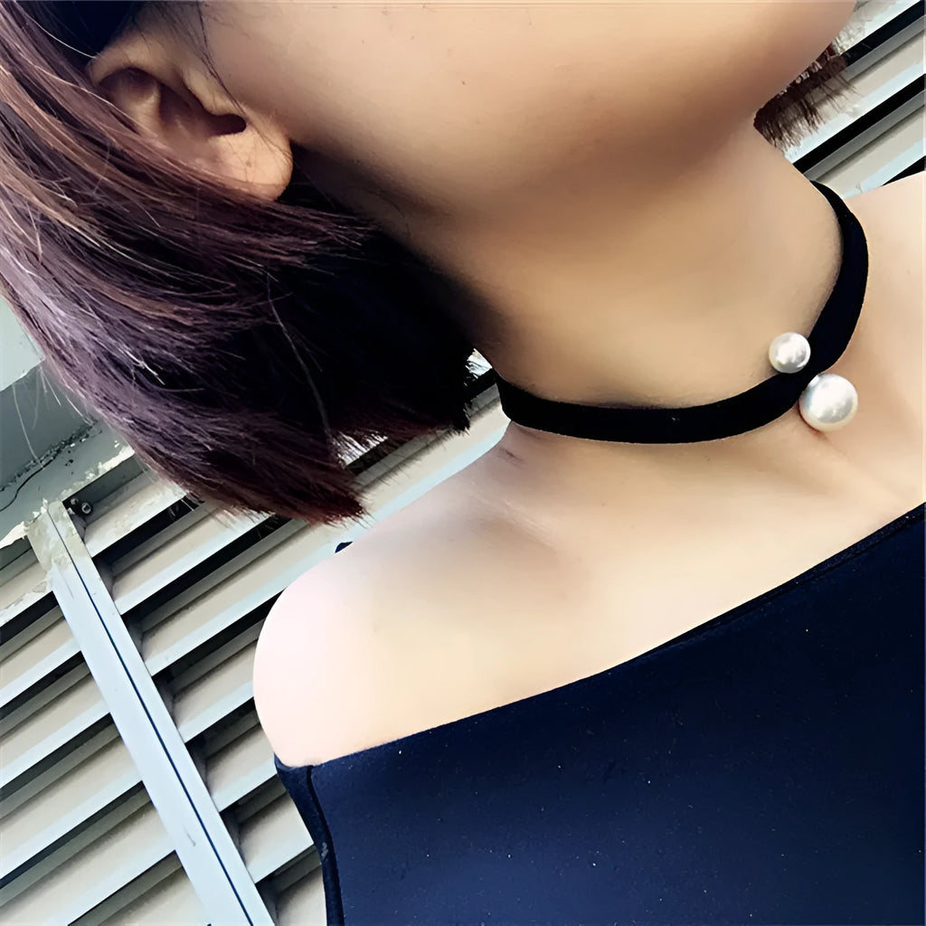 Hand-woven yarn necklace in black with simple college style on a white surface