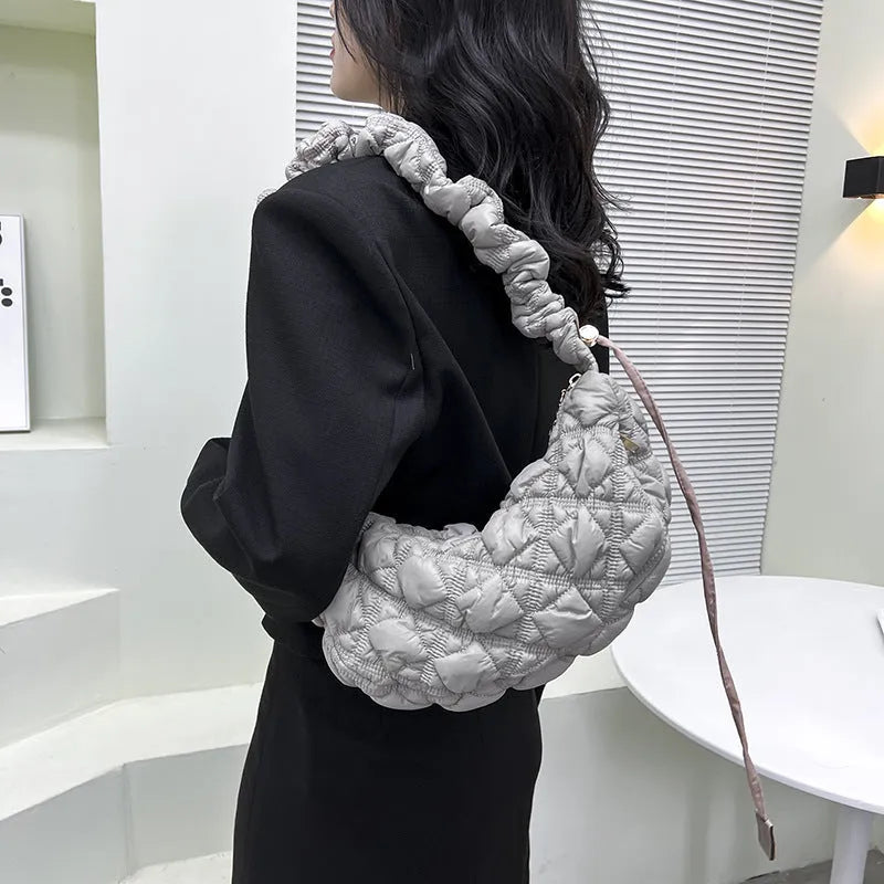 Women's nylon shoulder messenger bag in a solid colour with a long strap, showing front view.