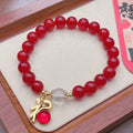 Handmade red agate bracelet with dragon and lucky bag Chinese designs for women.