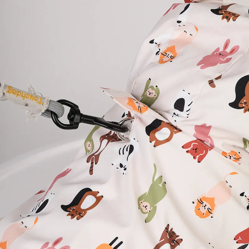 Beige dog raincoat with cartoon design featuring double waterproof PU coating