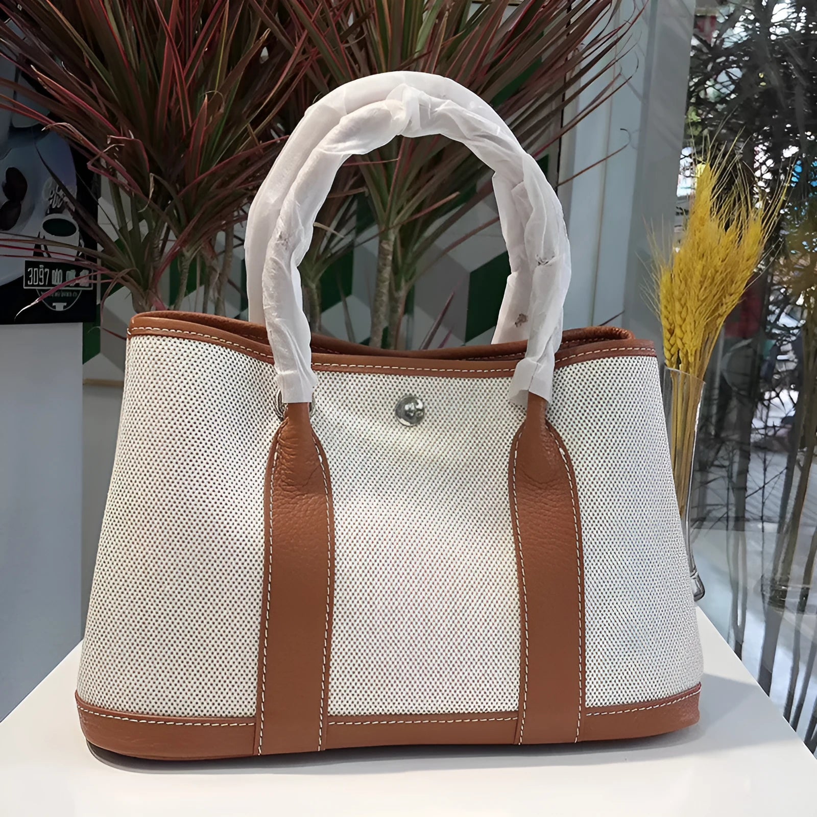 Genuine leather women's crossbody tote bag with canvas texture in bucket shape