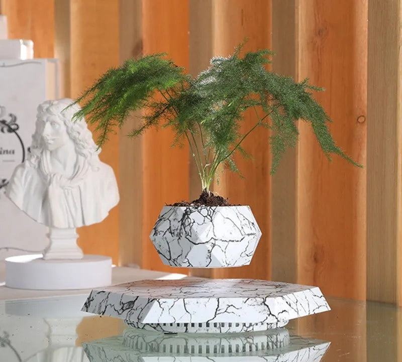 Marble colour levitating plant pot floating and rotating with magnetic technology