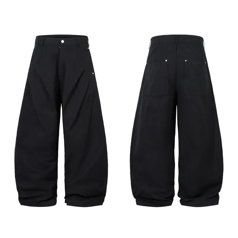 Men's black cotton loose-fit wide-leg trousers with machete pleats and an elasticated waistband