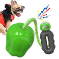 Green apple-shaped plastic dog chew toy with squeaker for teeth cleaning