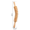 Assorted beech wood massage rollers including T-shaped and multi-wheel sets on a plain surface.
