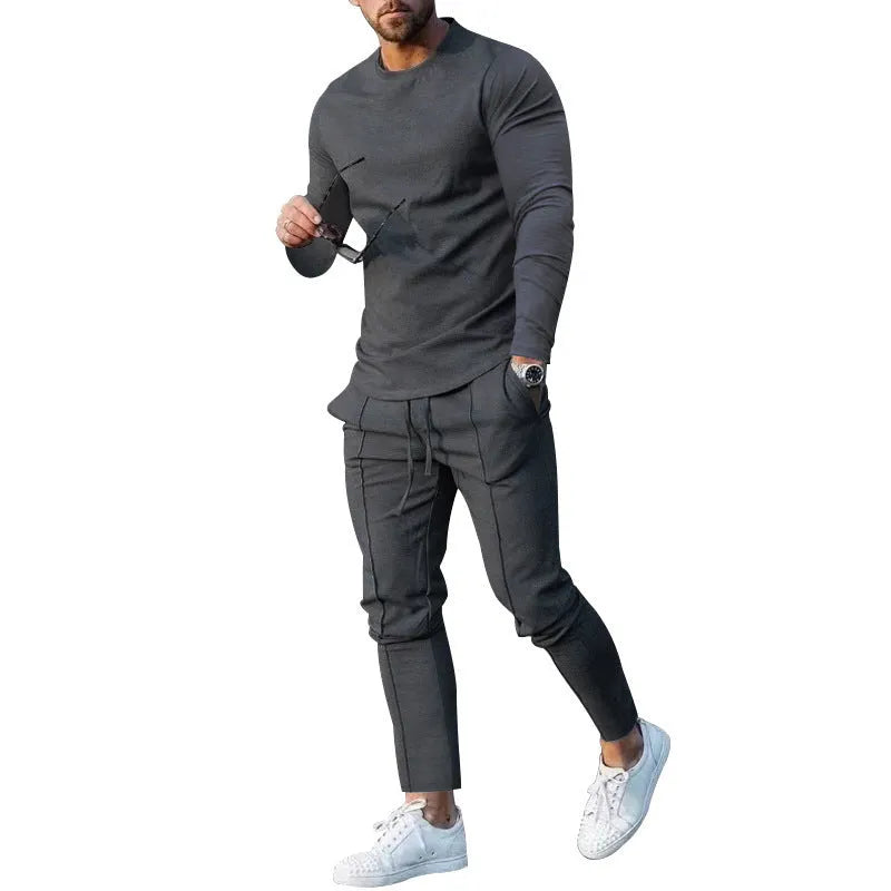 Men's solid colour two-piece polyester tracksuit with long sleeves, shown in apricot colour.
