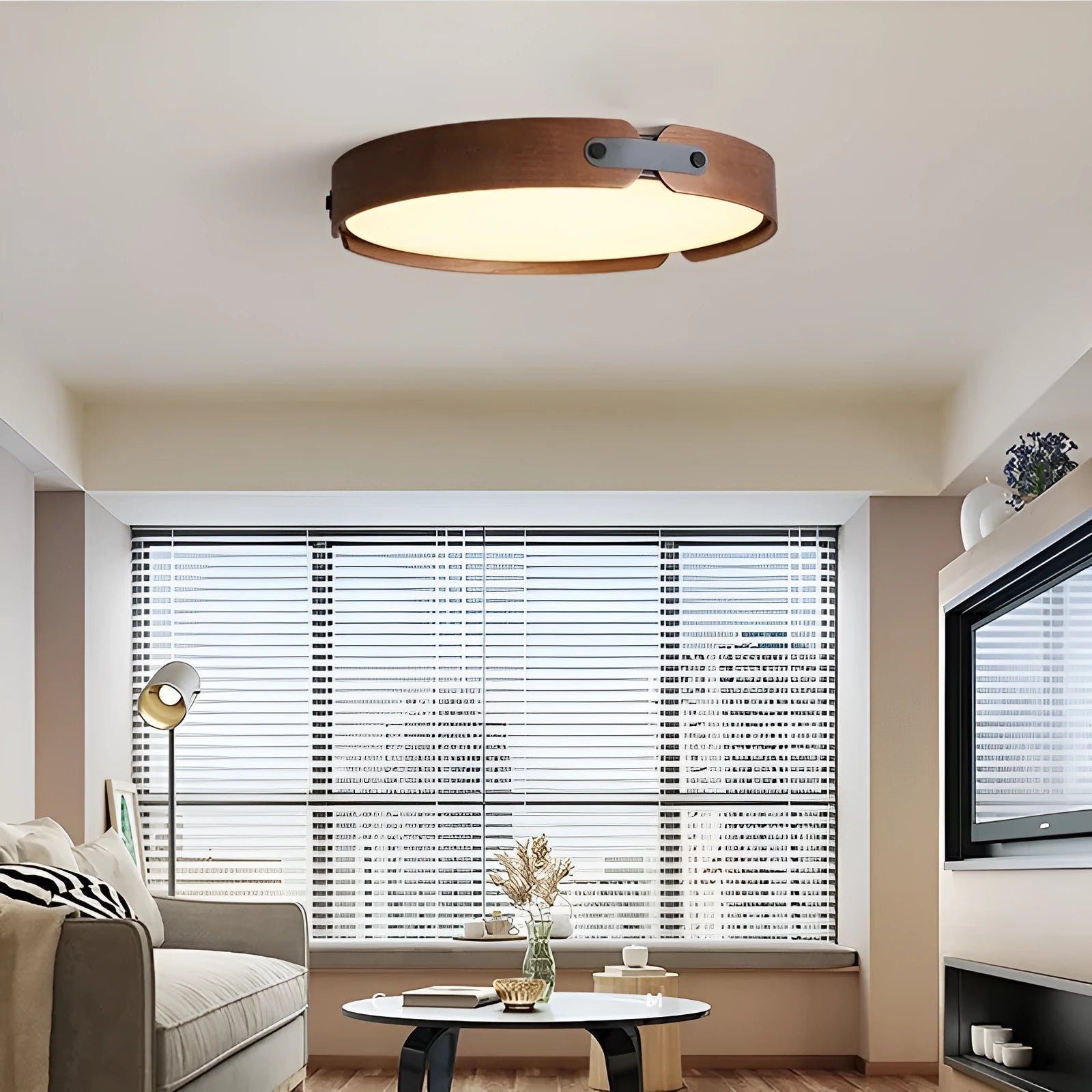 Japanese style wooden ceiling lamp with a round PMMA lampshade in warm light colour.